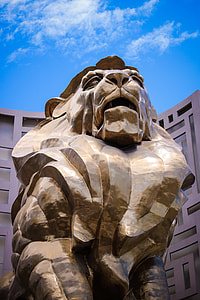 brown lion statue during day thumbnail