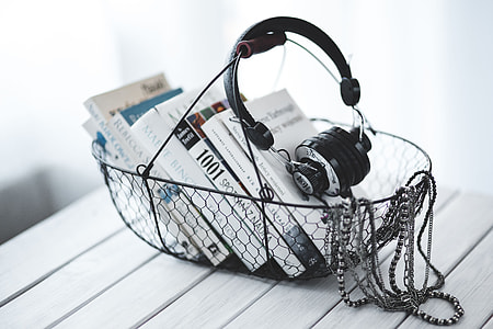 Black smartphone and headphones with various items thumbnail