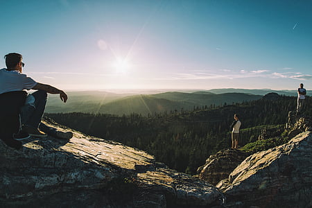 man sitting on top of mountain thumbnail