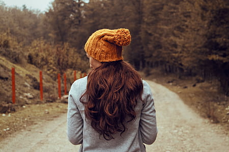 woman standing on gray rough road thumbnail
