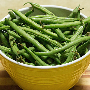 green string beans in yellow ceramic bowl thumbnail
