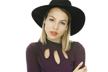 woman wearing purple turtleneck sweater and black hat thumbnail