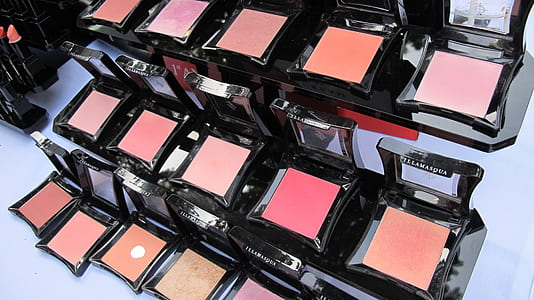 assorted-color makeup blush-on powders on white surface thumbnail