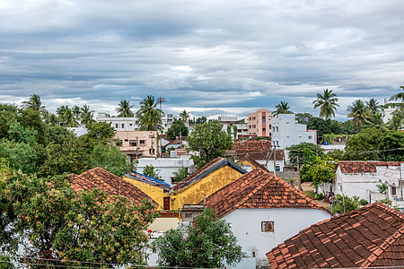 Rooftops view with clouds in a village in India thumbnail