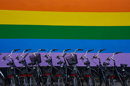 commuter bike organize parking in front of rainbow wall thumbnail