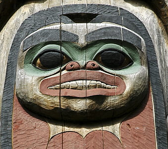 brown, black, and green wooden tiki mask thumbnail
