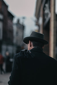 man in black hat with coat thumbnail
