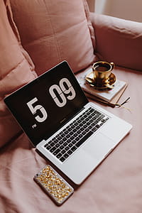 Workplace with a laptop on a pink couch thumbnail