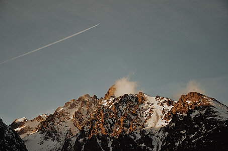 snow-covered mountain under clear blue sky thumbnail