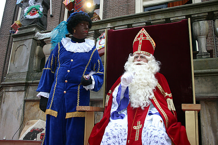 man in bishop costume standing beside man in blue and white long-sleeved robe thumbnail