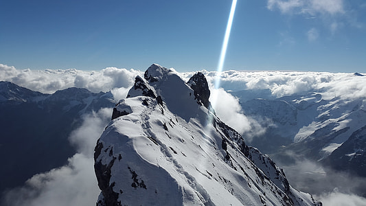 mountain peak covered with snow during daytime photo thumbnail