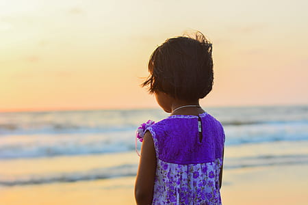 girl looking at sea at the beach thumbnail