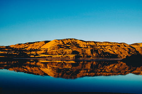 reflection photography of rock formation thumbnail