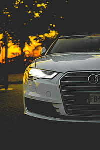tilt shift lens photography of white Audi car thumbnail