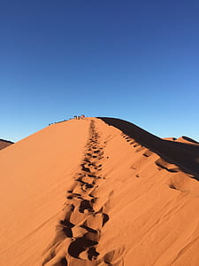 group of people walking on desert thumbnail