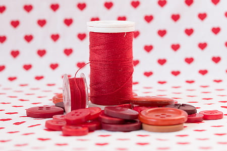 two red threads and buttons thumbnail