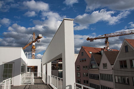 white and brown concrete building under blue sky thumbnail