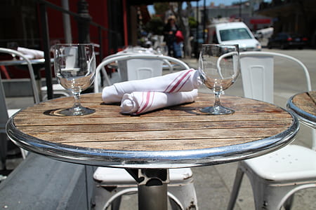 two wine glasses on top of table thumbnail