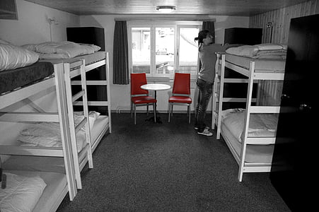 woman standing standing near wooden bunk bed thumbnail