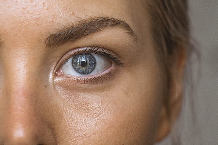 close up photo of person's left eye with gray pupil thumbnail