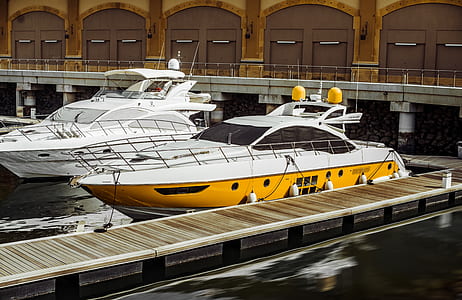 Photography of Two White Yacht on Body of Water thumbnail