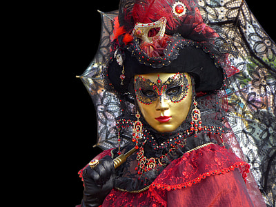 woman wearing red and black dress and gold-colored mask thumbnail