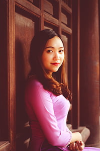 woman in pink long-sleeved top thumbnail
