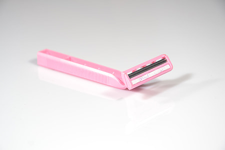 pink shaver on white surface thumbnail