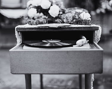Grayscale Photo Of Vinyl Record Album Playing In Turntable thumbnail
