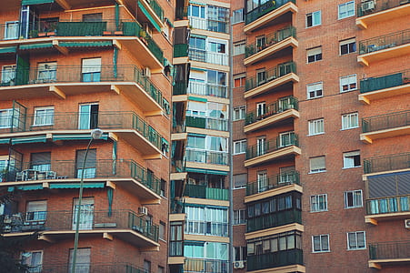 two brown apartment-style buildings thumbnail