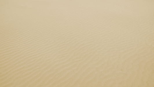 brown desert sand during daytime thumbnail