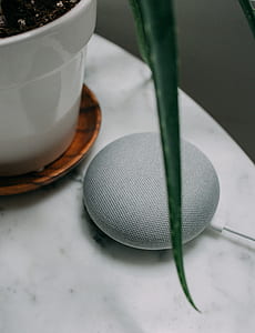 chalk Google Home Mini smart speaker on white table thumbnail