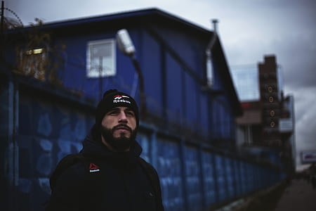 Man Wearing Black Shirt and Knit Cap thumbnail