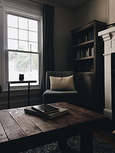 white throw pillow and grey cair thumbnail