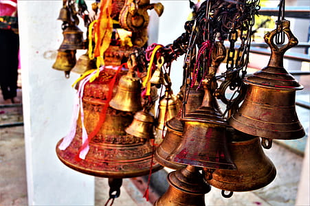 Hanged Brown Metal Bell in Close Up Photography thumbnail