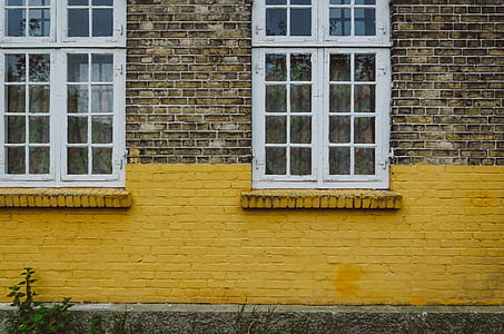 clear glass panel window on brown concrete wall thumbnail