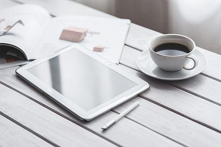 Coffee on a table with other items thumbnail