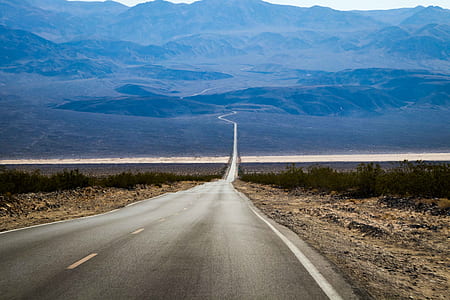 portrait photography of road during daytime thumbnail