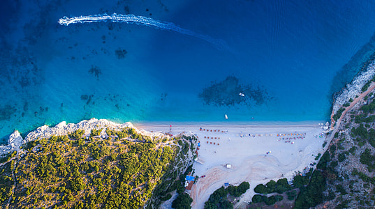 aerial photography of beach near the mountains thumbnail