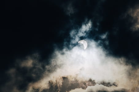 crescent moon and white clouds during nighttime thumbnail