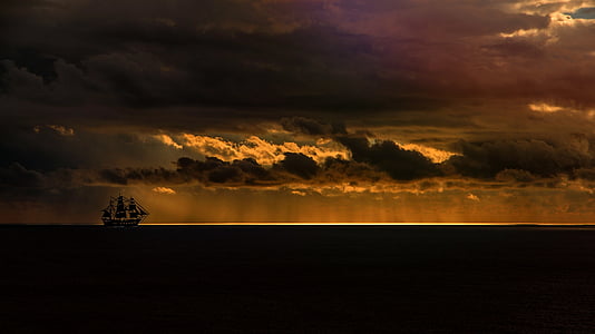 silhouette photography of white sailing ship on sea thumbnail