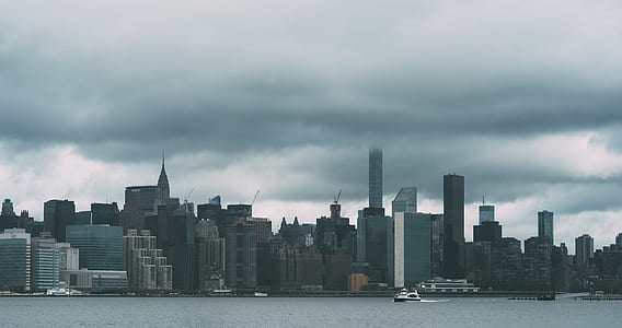 aerial view of high rise buildings under gray sky thumbnail