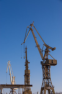 photo of white metal towers under clear blue sky at daytime thumbnail