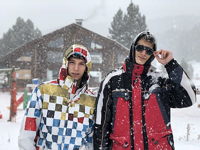 two men wearing winter coats thumbnail