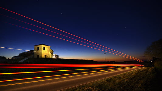 time-lapse of light passing on road during night time thumbnail