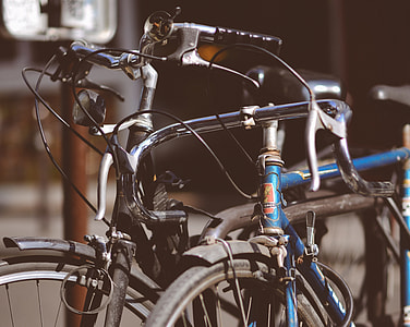 two blue and gray bicycles close up photo thumbnail