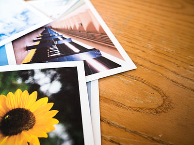 photos on brown wooden surface thumbnail