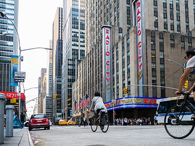 woman riding bicycle at city road thumbnail