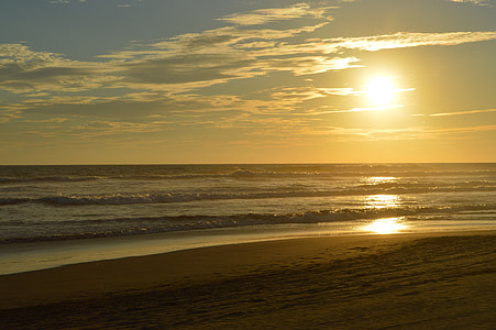 wave of body of water during golden hour thumbnail