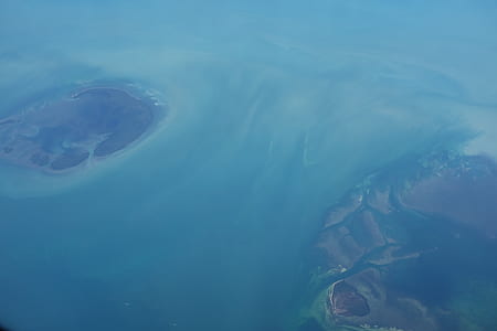 aerial photo of two body of water between two islands thumbnail
